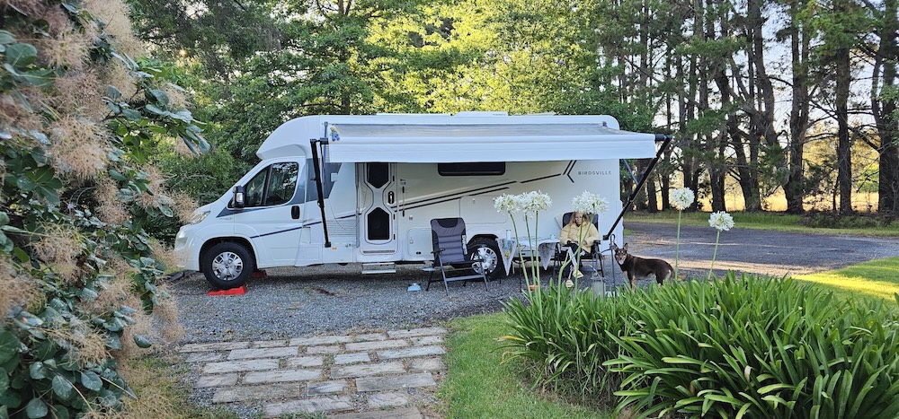 The OzLevel founder's Birdsville motorhome parked at a beautiful campsite, awning out, perfectly level